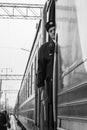 January 15, 2019. train conductor is on his duty on a platform and other trains