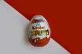 January 10, 2022 Ukraine city Kyiv Kinder  yummy sweet  delicious   gourmet Surprise chocolate egg on a colored background Royalty Free Stock Photo