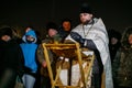 A priest of the Russian Orthodox Church reads prayers in honor of the baptism of the Lord Royalty Free Stock Photo