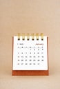 January 2025 white desk calendar on brown background Royalty Free Stock Photo