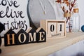 1 January wooden calendar with home sign. Happy winter holidays