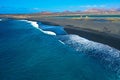 Janubio beach is between the salt flats and Los Hervideros. This black beach covered in lava ash. Aerial view. Lanzarote, Spain.