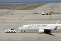 Japan Airlines Boeing 737-800 manipulation at Chubu Centrair International Airport, Japan Royalty Free Stock Photo