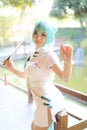 Japan anime cosplay portrait of a girl with chinese dress costume in chinese garden Royalty Free Stock Photo