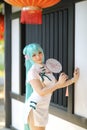 Japan anime cosplay portrait of a girl with chinese dress costume in chinese garden Royalty Free Stock Photo