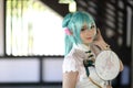 Japan anime cosplay portrait of a girl with chinese dress costume in chinese garden Royalty Free Stock Photo