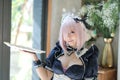 Japan anime cosplay portrait of girl with comic maid costume