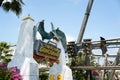 Japan - April 03, 2023: The Flying Dinosaur amusement park with people playing and excited extreme roller coaster in Universal