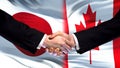 Japan and Canada handshake, international friendship relations, flag background