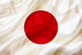 Japan country flag on silk or silky waving texture Royalty Free Stock Photo