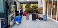 Bellboy or driver lifting and loading bag and luggage into the vehicle or bus