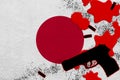 Japan flag and black firearm in red blood. Concept for terror attack or military operations with lethal outcome