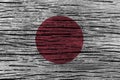 Japan flag with high detail of old wooden background . Royalty Free Stock Photo