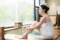 Japan girl sitting on poolside of hot springs Royalty Free Stock Photo