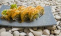 Japan gourmet cuisine - closeup detail on delicious and delicate dish of Japanese sushi rolls in slate on stone bg in traditional Royalty Free Stock Photo