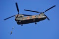 Japan Ground Self Defense Force paratroopers jump out the back of a CH-47J Chinook heavy-lift helicopter. Royalty Free Stock Photo