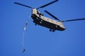 Japan Ground Self-Defense Force paratroopers jump out the back of a CH-47J Chinook heavy-lift helicopter. Royalty Free Stock Photo