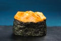 Japan gunkanmaki sushi baked with cheese on blue background Royalty Free Stock Photo