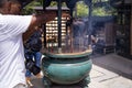 8.2018 Japan Kyoto.Buddhist temple.Visitors pray on area of Kinkaku-ji shrine