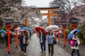 Japan, Kyoto, 04/07/2017. Gate to Japanese park with cherry blossoms Royalty Free Stock Photo