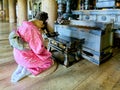 Japan. Kyoto. Kiyomizu Dera Temple. A faithful young woman kneeling in prayer