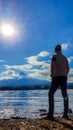 Japan - A man standing at the side of Kawaguchiko Lake with the view on Mt Fuji Royalty Free Stock Photo