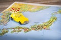 Japan map paper yellow beetle toy car background
