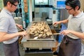 Japan. Miyajima. Hiroshima. Grilling oysters in a restaurant