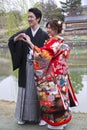 Japanese couple in traditional wedding dresses Royalty Free Stock Photo