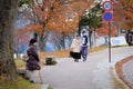 Alone old woman waits along the street of Nikko, Japan