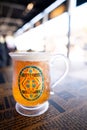 JAPAN - NOV 13, 2023: Delicious BUTTERBEER craft drink alcohol free with honey bee vintage label on a glass in Warner Bros. Studio