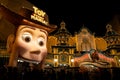 JAPAN - NOV 16, 2023: Toy Story Mania! Woody Pride wear cowboy hat open mouth and Carnival Corral entrance for interactive