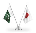 Japan and Pakistan table flags isolated on white 3D rendering