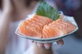 Japan raw salmon slice or salmon sashimi in japanese style. Salmon sasimi on hand Royalty Free Stock Photo