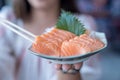 Japan raw salmon slice or salmon sashimi in japanese style. Salmon sasimi on hand Royalty Free Stock Photo