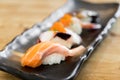 Japan raw salmon sushi and fresh mix sushi set in black plate - Japanese food set style at Japanese restaurant Royalty Free Stock Photo