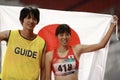 Japan`s Uran Sawada 706 and her guide Shiokawa Ryuhei celebrate Asian Para Games 2018