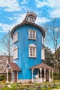 The Moomin house with Moominpappa waving with his hand in the Japanese park Moominvalley park.