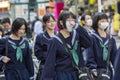 Japan, Tokyo, 04/12/2017. A group of Japanese schoolgirls on a city street