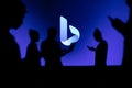 JAPAN, TOKYO. JANUARY 30, 2023: Bing Collaborating for Innovation: Silhouetted Web Developers in Action with Company Logo in