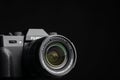 Fujifilm camera with fujinon aspherical lens on black background