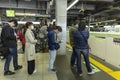 Japan, Tokyo 04/04/2017. People in the subway stand in line, waiting for the train