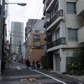 Three musicians go on the road. Tokyo residential area, apartment buildings