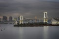 Japan Travel Destinations. Closeup View of Rainbow Bridge in Odaiba Island in Tokyo At Twilight with Line of Skyscrapers Royalty Free Stock Photo