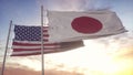 Japan and United States flag on flagpole. Japan and United States waving flag in wind. Japan and United States