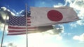 Japan and USA flag on flagpole. Japan and United States waving flag in wind. Japan and United States diplomatic concept