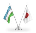 Japan and Uzbekistan table flags isolated on white 3D rendering
