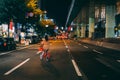 Japan woman cycling road at night