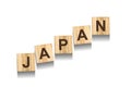 Japan, word on wooden blocks. Isolated on a white background.