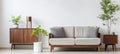 Japandi modern living room with grey armchair, beige loveseat, and poster frames on white wall